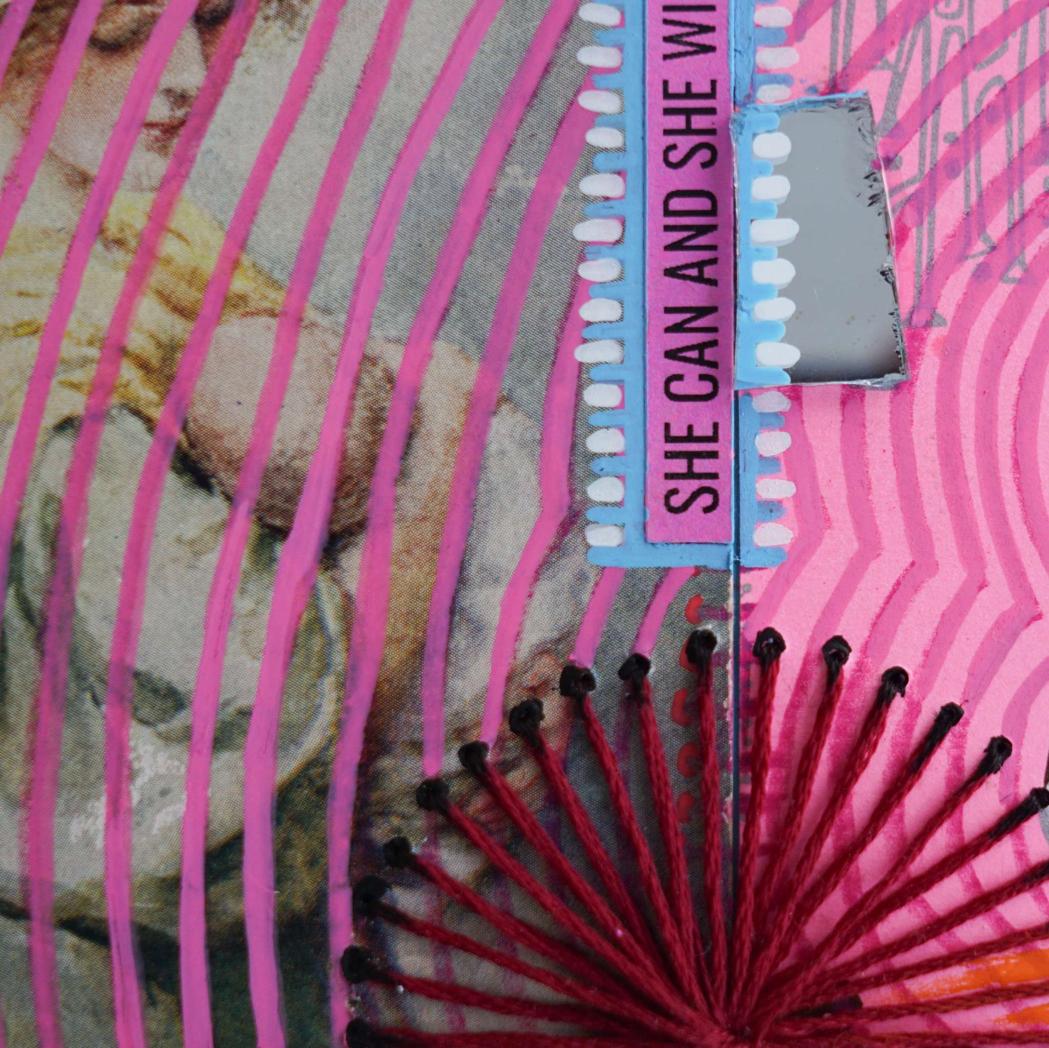 Close-up of mixed media collage with a motivational quote on a colorful background