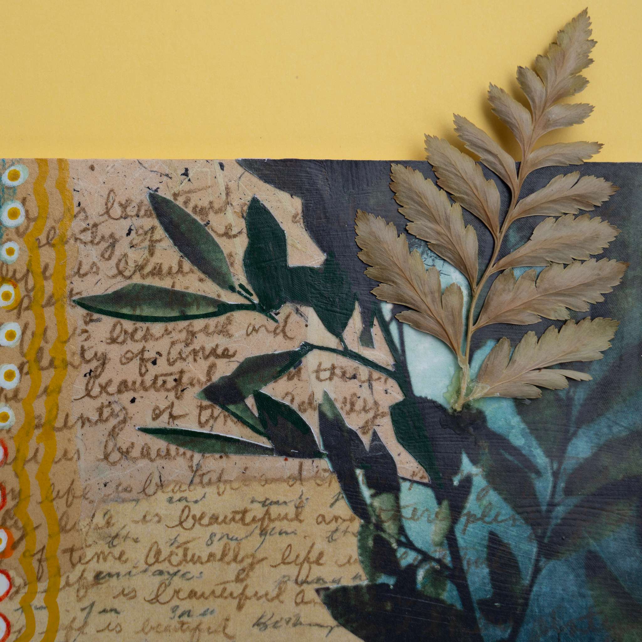 Detail of leaves on a textured surface with handwritten cursive text overlay.